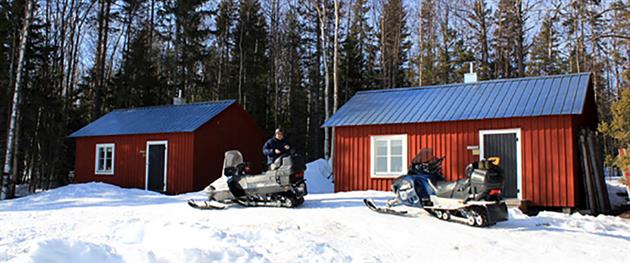 The cottages at Vargön in winter, Piteå kommun