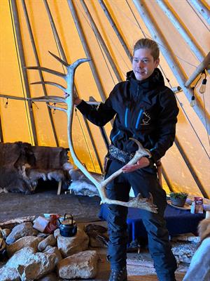 Tourist with reindeers