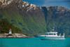 Pilagutt anchored in the Hardangerfjord, surrounded by majestic mountains and turquoise water. The ultimate fjord experience.