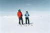 A couple on a ski trip taking a break to enjoy the sun at Hardangervidda.