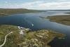 A drone photo of the Halnekongen boat heading towards the halne dock.