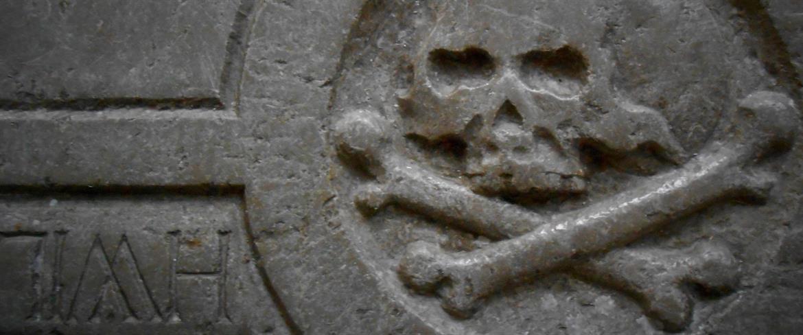 Scull engraving from a floor stone in Piteå Church.